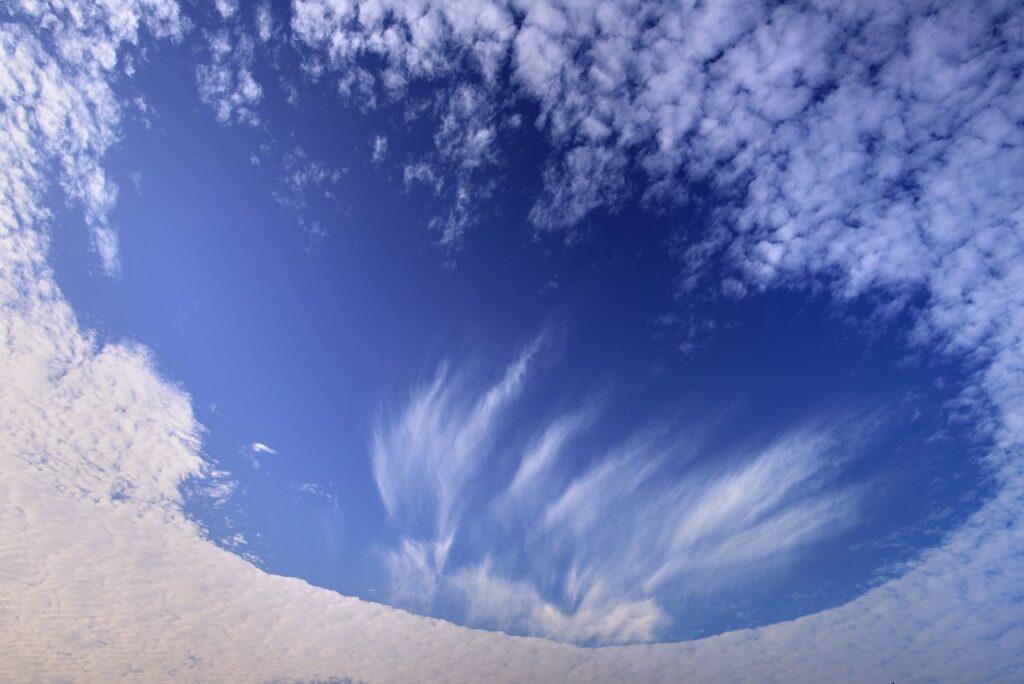 Ground Alien Spaceship Shaped Hole in the Clouds Captured by NASA